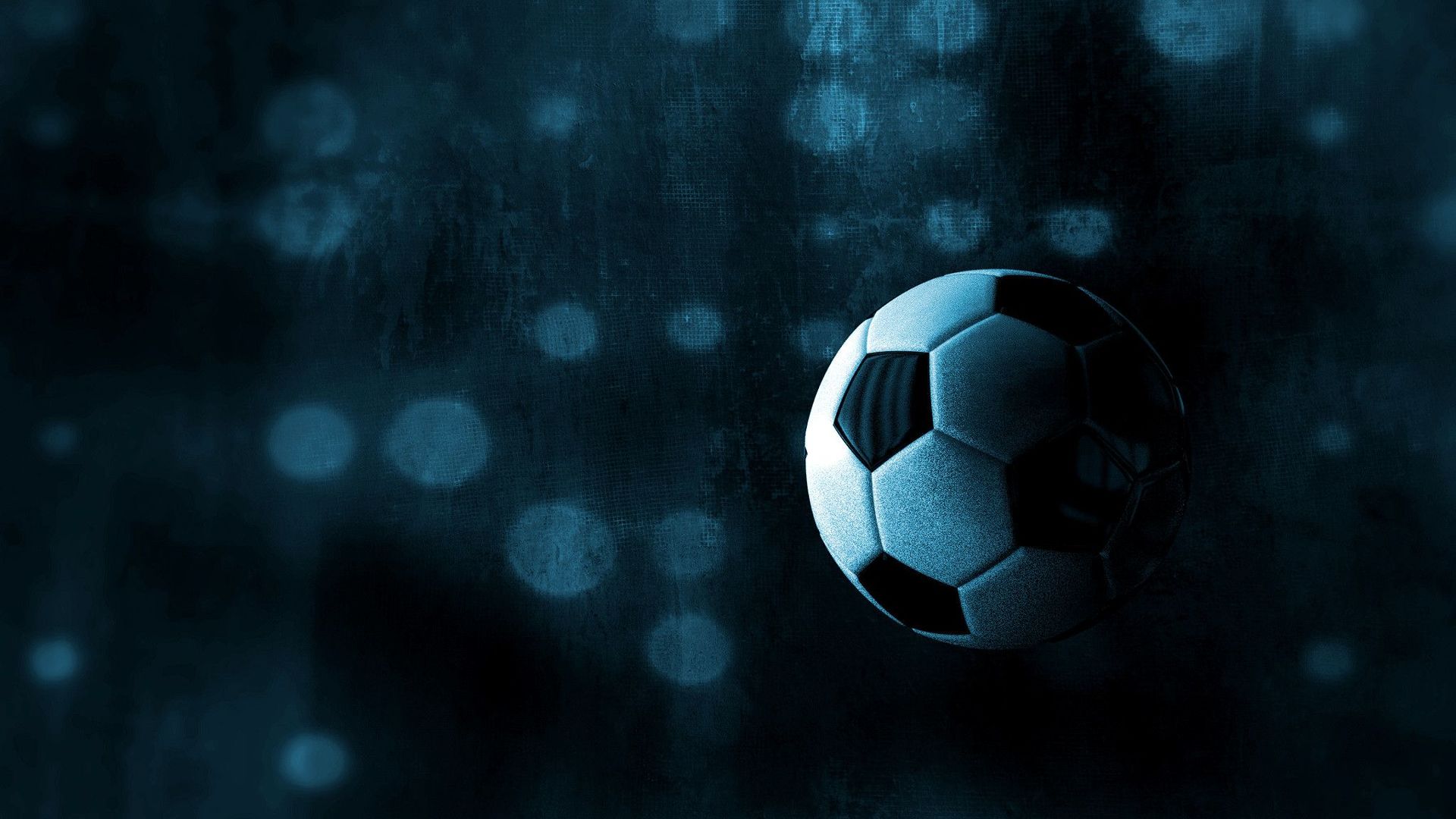Pelota de futbol con fondo oscuro